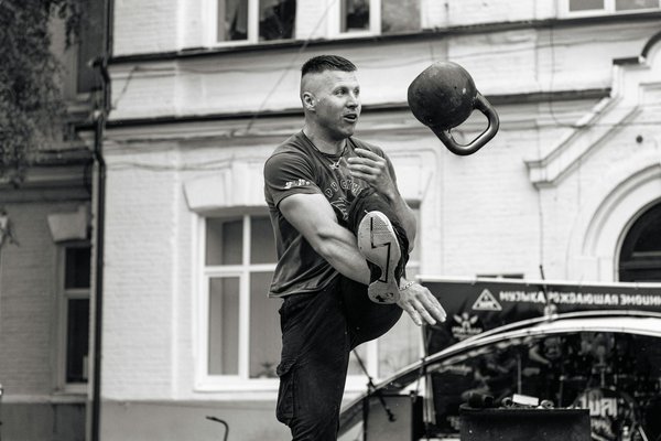 How can a shot put athlete enhance grip strength for better performance?